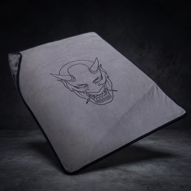 Oni XL microfibre drying towel 60x80cm laid flat, grey with oni mask print